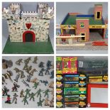 A collection of vintage toys including a model garage/petrol station on a base 61 x 46cm, with a