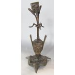 An French Art Nouveau bronze candlestick of bullrushes supporting the sconce set in a vase. 24cm