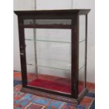 A small Edwardian shop counter top display cabinet with mahogany frame, glazed panelled surround