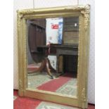 19th century gilded overmantle mirror with repeating geometric detail, enclosing a bevelled edge
