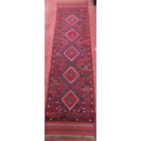 A Meshwani runner with a central diamond patterned panel. 250cm x 59cm.