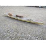 A fibreglass canoe and paddle with applied label Moonraker built from a kit supplied by Jenkins &