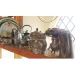 A large collection of hand beaten pewter tea and table ware, including tea and coffee pots, tazza