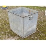 A heavy gauge two handled vintage galvanised steel trough of rectangular and slightly tapered form