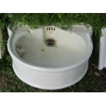 A Doulton & Co Ltd Lambeth London, bow fronted cream glazed stoneware hand basin together with a
