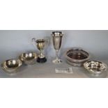 A miscellaneous collection of items including a Middle Eastern beaten copper vase, copper