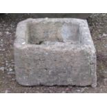 A weathered natural stone thick walled rectangular trough (irregular shaped) 50 cm long x 45 cm wide