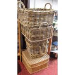 A wicker picnic basket, a pair of cane double handled open baskets and a tall cane basket with