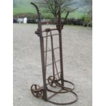 An antique cast iron two wheeled sack trolley with chain winding lever lifting gear, stamped A Jones