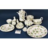 A collection of tea, coffee and dinnerwares by Wedgwood in the Wild Strawberry pattern comprising