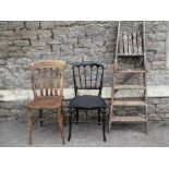 A Windsor elm and beechwood lathe back kitchen chair together with an ebonised single chair and a