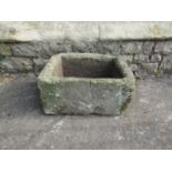 A small weathered natural stone trough of rectangular form (af) old crack/repair, 47 cm long x 38 cm
