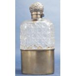 A Victorian cut glass flask with engraved silver cap and a silver protector sleeve to base, London