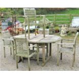 Weathered teak D-end extending garden table with slatted panelled top and two bi-folding leaves,