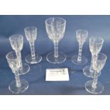 Twelve Georgian style facetted drinking glasses in three sizes