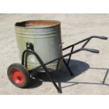 A vintage water barrow with pivoting oval galvanised tin receptacle raised on a tubular frame with