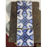 A set/run of 14 reclaimed French glazed floral pattern tiles 10cm square (stamped to reverse)