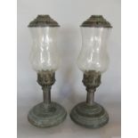 A pair of weathered bronze hurricane lamps with etched glass shades with wind covers. 32cm high.