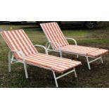 A pair of contemporary painted light steel framed garden or poolside loungers with adjustable