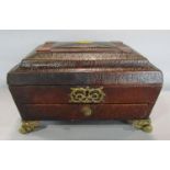 A 19th century ladies sarcophagus shaped vanity box with gilded tooled leather interior and a mirror