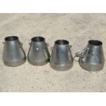 Three matching stainless steel conical shaped milk pails with loose loop handles, together with