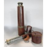 A John Barker four section leather clad telescope, and a leather clad Otis Kings pocket calculator.