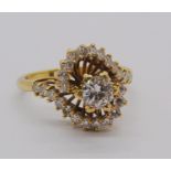 Impressive vintage diamond cluster ring of stylised crossover design, centre stone 0.50cts approx,