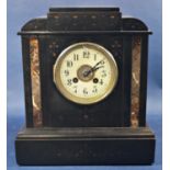 A Victorian black slate and polished marble mantle clock with eight day striking movement