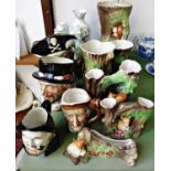 Two Doulton character jugs, Long John Silver and Beefeaters, Hornsea pottery vases or tree trunks,