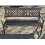 A weathered contemporary teak three seat garden bench with lattice panelled back over slatted
