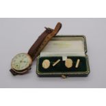 Pair of 1960s 9ct cufflinks, 1.8g, together with an early 20th century 9ct watch with leather