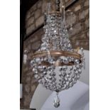 An Edwardian style crystal three tier gilt bag chandelier. 27cm diam.