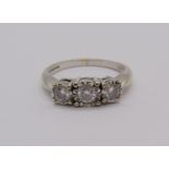9ct white gold three stone diamond ring, centre stone 0.20cts approx, 0.50cts total, size N, 3.4g