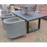 A collection of rattan garden furniture comprising table of rectangular form with inset glass top,