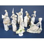 A collection of Lladro and Lladro Daisa figures including a girl holding a lamb, a girl with geese
