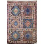 A small Iranian Yalameh rug with a panelled design. 90cm x 60 cm approx