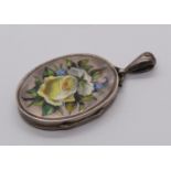Aesthetic movement silver locket decorated in enamel with a floral bouquet, maker 'T.W' possibly