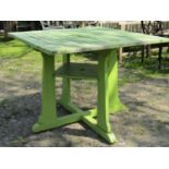 Attributed to Heals, stained and later light green painted and weathered teak garden table, the