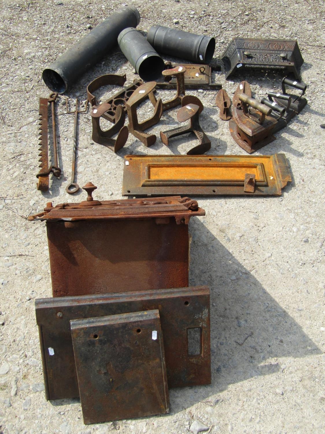 The remains of an antique cast iron range, further fire related items, cast iron flat irons, various - Image 2 of 3