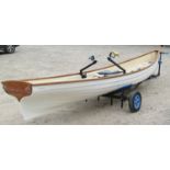 A Little River Heritage single scull rowing boat with fibre glass hull and wooden trim, impressed