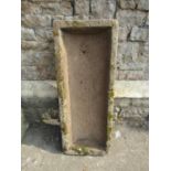 A good weathered natural stone trough of rectangular and slightly tapered form, 97 cm long x 38 cm