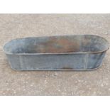A vintage oval two handled galvanised tin bath, 135 cm long x 53 cm wide
