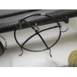 A heavy gauge ring hung iron game crown with four S shaped scrolled hooks 50 cm diameter