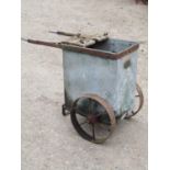 A vintage two wheeled iron framed and galvanised steel bodied portable tree sprayer (incomplete