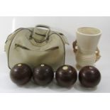 Four Lignum Vitae vintage lawn bowling balls, a Clarice Cliff white and gilt overlay vase