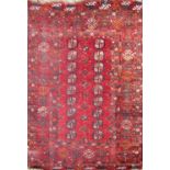 An early 20th century Turkoman rug with two rows of small elephant foot gul on a red ground.170cm