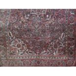 A middle eastern design carpet with an all over scrolling floral pattern, 300cm x 190cm