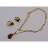 Stylised Italian 14ct earrings and matched pendant set with garnet coloured stones, hung on an
