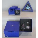 Swarovski crystal 30th Anniversary star ornament, a crystal ballerina beneath a glass dome, and a