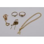 Group of 9ct jewellery comprising a curb link bracelet with 'M' charm, a wishbone ring, a diamond